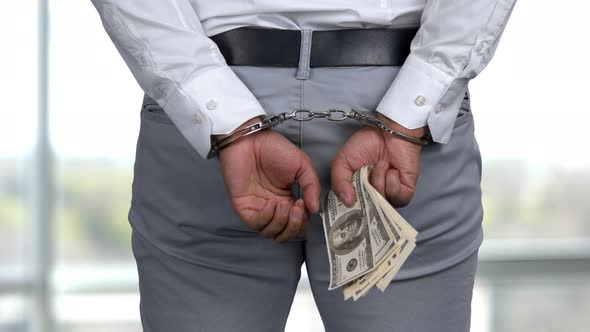 Closeup Man's Hands Arrested for Financial Crimes