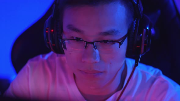 Asian Teenager in Underground Gaming Club