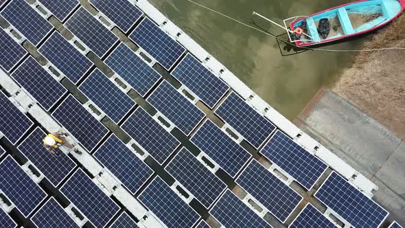 Solar panels installation project for floating solar farm in Asia, aerial view