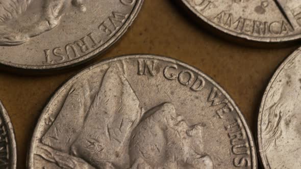 Rotating stock footage shot of American nickles (coin - $0.05) - MONEY 0198