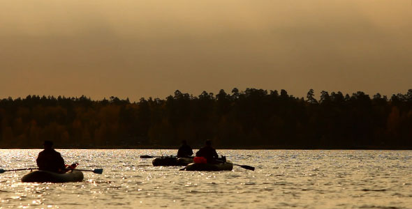 Rowing Fishermen On The Lake