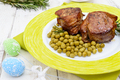 Juicy pork medallions wrapped in bacon, serve with green peas - PhotoDune Item for Sale