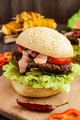 Burgers with liver cutlet, tomatoes, pickles, lettuce, spicy sauce and a soft bun - PhotoDune Item for Sale