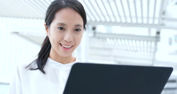 Business woman use of laptop computer at outdoor