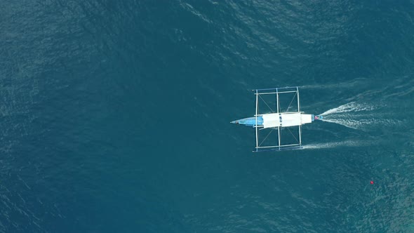 WS AERIAL TS HA Camera following outrigger boat in sea, El Nido, Palawan, Philippines