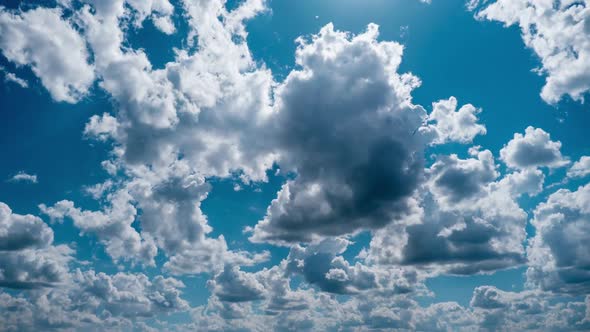 Timelapse of Light White Puffy Clouds Moving in the Blue Sky Cloud Space