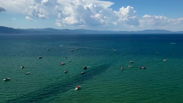 Boats Crusing Across Clear Blue Waters Of Lake Tahoe In California. aerial hyperlapse