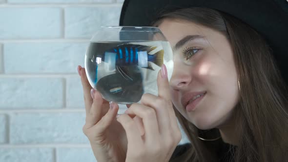 Girl with an aquarium. 