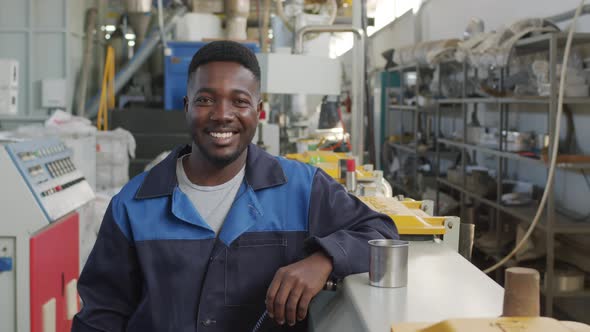  Portrait of Cheerful African-American Male Factory Worker