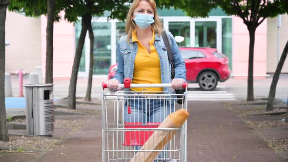 Woman in Mask with Shopping Cart