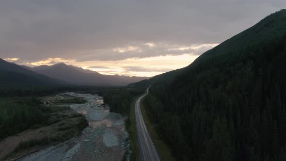 Beautiful View of Scenic Road By Glacial River at Sunset