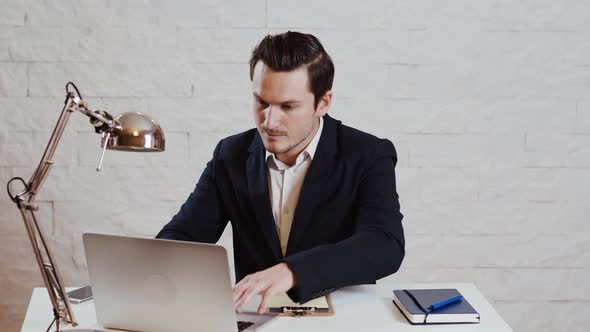 Young businessman working at the computer