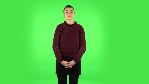 Girl Listens Carefully To Boring Information. Green Screen