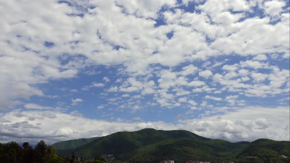 Blue Sky White Clouds Over the Mountains