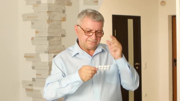 Gray Haired Man Reads the Instruction in His Poor Eyesight