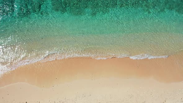 Wide angle fly over copy space shot of a summer white paradise sand beach and aqua turquoise water b