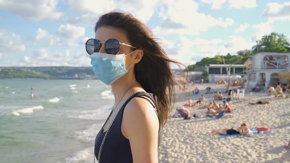 Woman Wearing Protective Mask in the Public. Traveling During Pandemic COVID-19