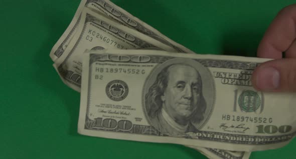 Dollars. American Money Close-up on a Green Background Hromakey . 100 Dollar Bills. One Hundred