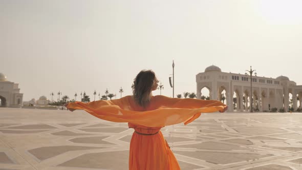 Girl Posing Against the Backdrop of Qasr Al Watan, UAE Presidential Palace in Abu Dhabi