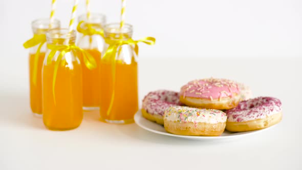 Donuts and Lemonade or Juice in Glass Bottles