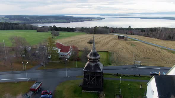 Lakeside Village Town Streets, Buildings And Open Rural Fields Near Ostersund, Sweden. 4K Drone.