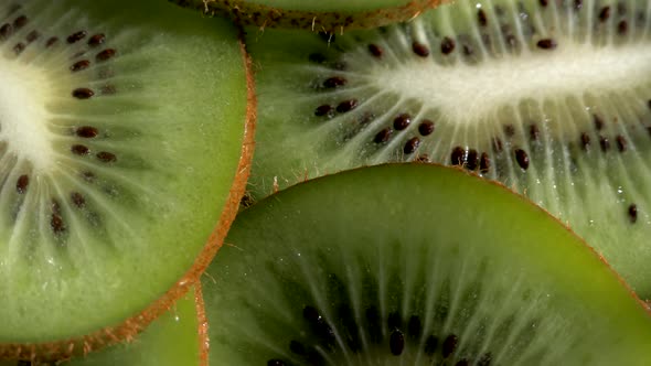 Kiwi Tropical Fruit. A Slice of Green Fruit. Kiwi Pulp Close Up.