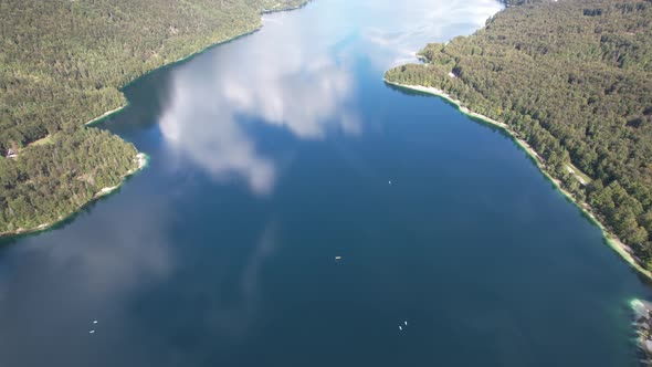 Aerial view on Bohinj lake between mountains with forest in Slovenia, Europe