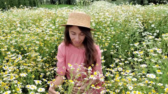 Young Attractive Woman in Field of White Flowers