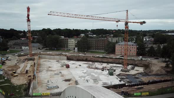 Drone shot of construction of Tartu university Delta Centre, flight over the bridge