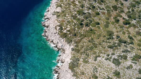 Aerial View of Clear Turquoise Water Near the Rocky Coast of the Aegean Sea