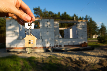 round of a construction site and walls made of porous concrete block. Building a home, moving to a new cottage, farm in the countryside