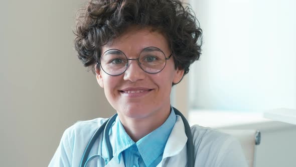 Joyful female doctor at workplace