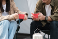 Cropped image of man and woman sitting in chairs outside the tent. - PhotoDune Item for Sale