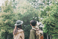 Couple walking with backpacks over natural background - PhotoDune Item for Sale