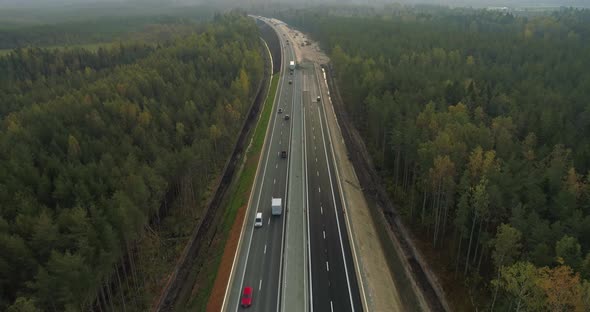 Aerial View of a New Highway Road Construction in Green Forest