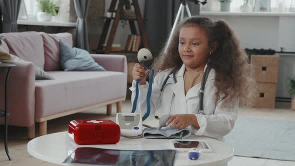 Cheerful Girl Playing Doctor at Home