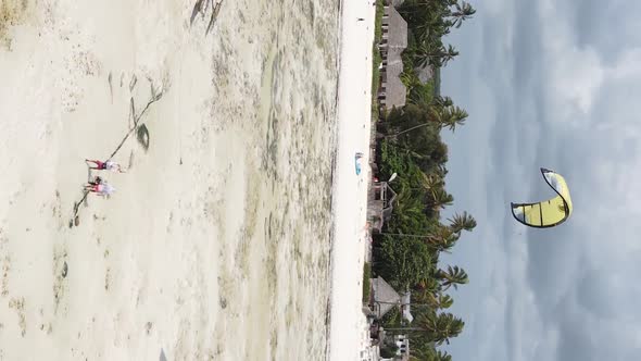 Vertical Video Kitesurfing Near the Shore of Zanzibar Tanzania Aerial View