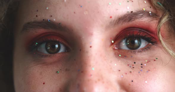 Close up of a girl face covered of glitter