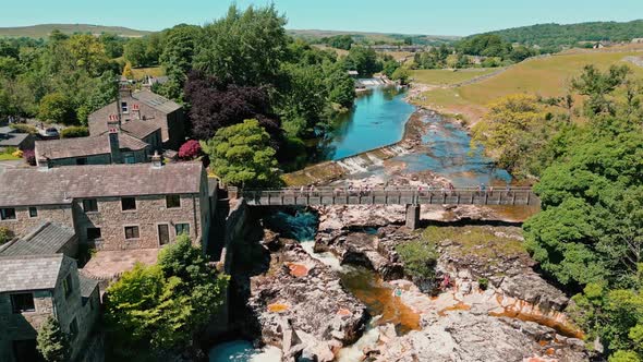 Drone Ariel footage of Linton Falls Wharfedale Yorkshire Dales National Park UK