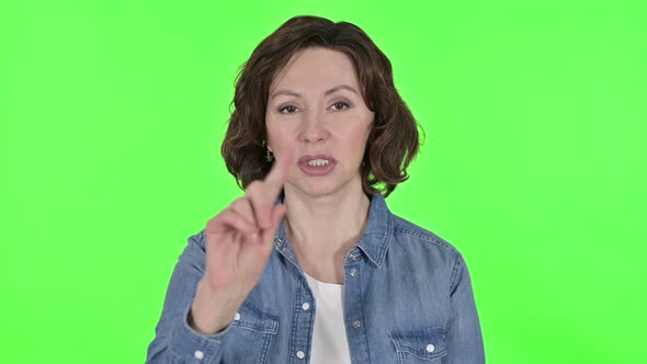 No, Finger Sign By Old Woman on Green Chroma Key Background