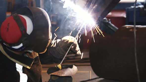 The Welder Works Out the Skill of Welding Pipes on the Simulator