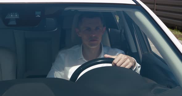 Portrait of Mature Ceo Executive Sitting in a Car on Drivers Seat