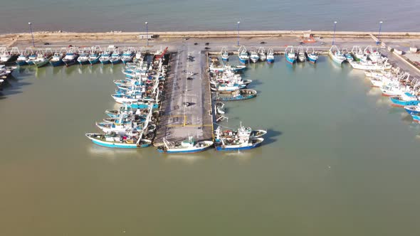 Fishing Boats in a Small Port Aerial Overhead View From Drone