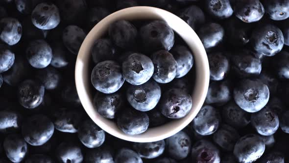 Freshly picked juicy blueberries background, flat lay. Blueberries texture