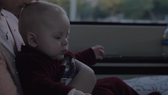 Baby Girl on Mothers Lap in the Car