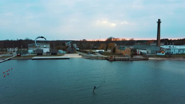 Aerial Drone View of a Corekites Kitesurfers Hydrofoiling  in Engure Port at in Baltic Sea