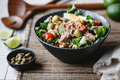 Canned tuna salad with fresh vegetables, capers and olives in a black bowl - PhotoDune Item for Sale