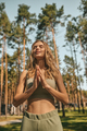 Cute blonde woman practising yoga outside and looking relaxed - PhotoDune Item for Sale