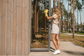 Young blonde housewife cleaning the house doors - PhotoDune Item for Sale