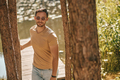 A young man in sunglasses in the forest near the river - PhotoDune Item for Sale